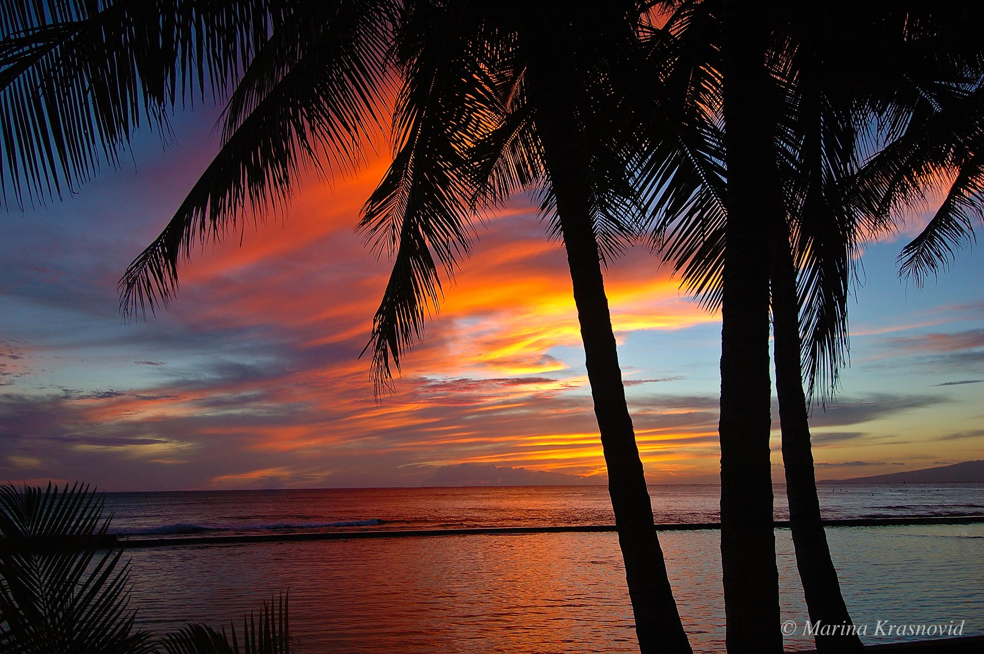 Beautiful sunset on the shore of Waikiki, Oahu, Hawaii.