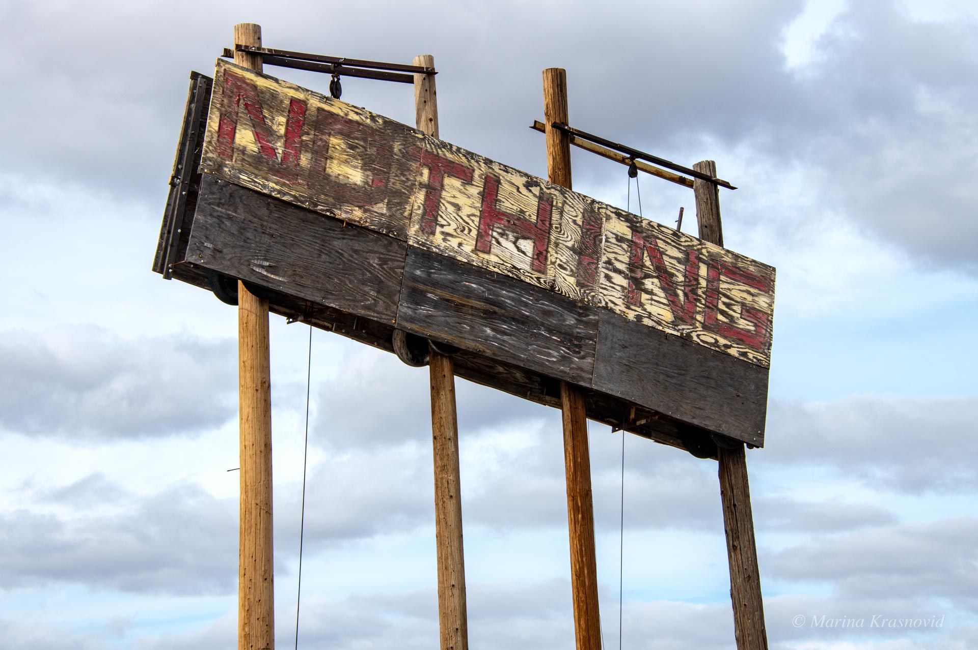 Nothing, Arizona. Weathered wooden roadside sign reading “Nothing” in Nothing, Arizona, a ghost town along US-93 in Mohave County, northwest of Phoenix.