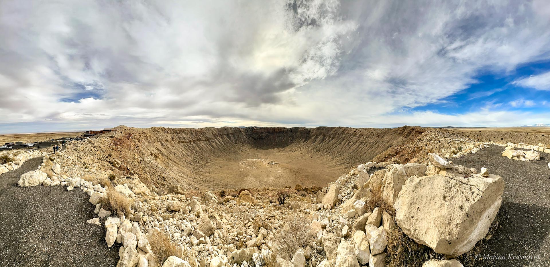 Wide panoramic view of Meteor Crater in northern Arizona, showing the full rim and the depth of the impact crater formed about 50,000 years ago.